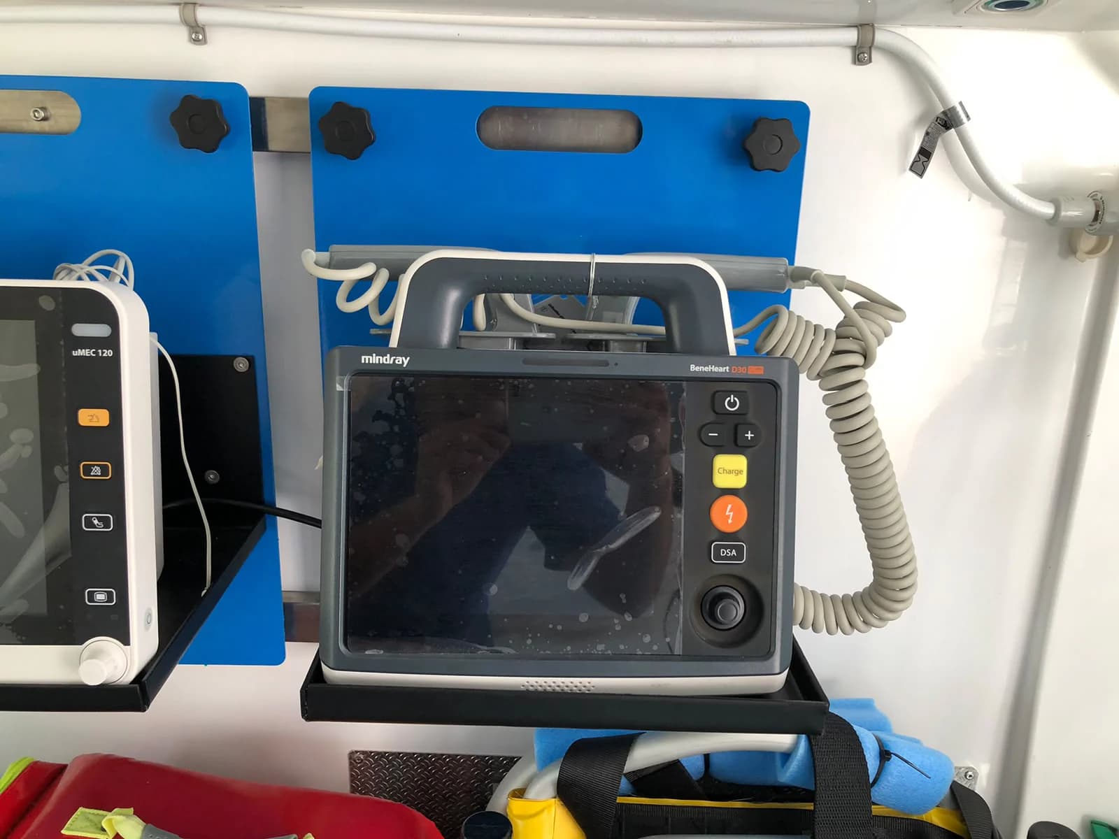 Mindray defibrillator mounted inside an EMS ambulance compartment